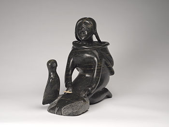 Young Woman Preparing a Pelt with Owl Guide by Osuitok Ipeelee sold for $6,875