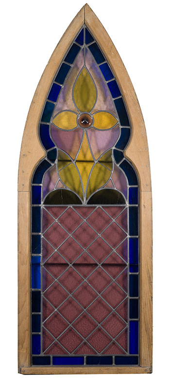 A Neo-Gothic arch form stained glass window with pine frame by 19th Century North American School vendu pour $563