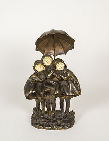 Three Children with Umbrella by Demeter H. Chiparus sold for $2,375