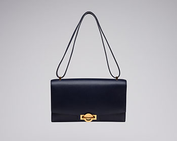 A VINTAGE BLEU MARINE BOX SAC OLYMPE GOLD HARDWARE by  HERMÈS sold for $1,875