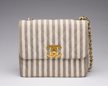 A VINTAGE WHITE & GREY STRIPED CANVAS SQUARE FLAP BAG by  CHANEL sold for $2,500