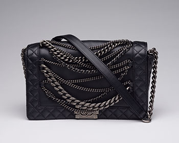 A BLACK LEATHER ENCHAINED MEDIUM BOY BAG WITH ANTIQUED SILVER-TONE HARDWARE by  CHANEL sold for $4,688