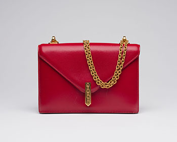 A VINTAGE RED BOX ALCAZAR WITH GOLD HARDWARE by  HERMÈS