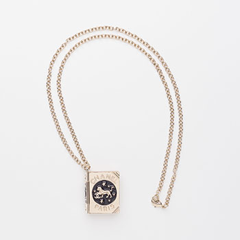 A LION BOOK LOCKET PENDANT NECKLACE by  CHANEL