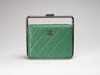 A RARE GREEN QUILTED LAMBSKIN LEATHER METAL BAR FRAME CLUTCH WITH STRAP by  CHANEL