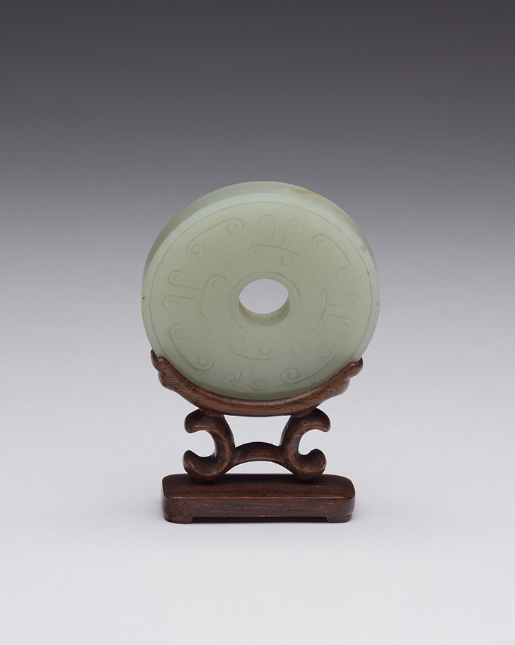 A Chinese Pale Celadon Carved Bi Disc, 19th Century par  Chinese Art