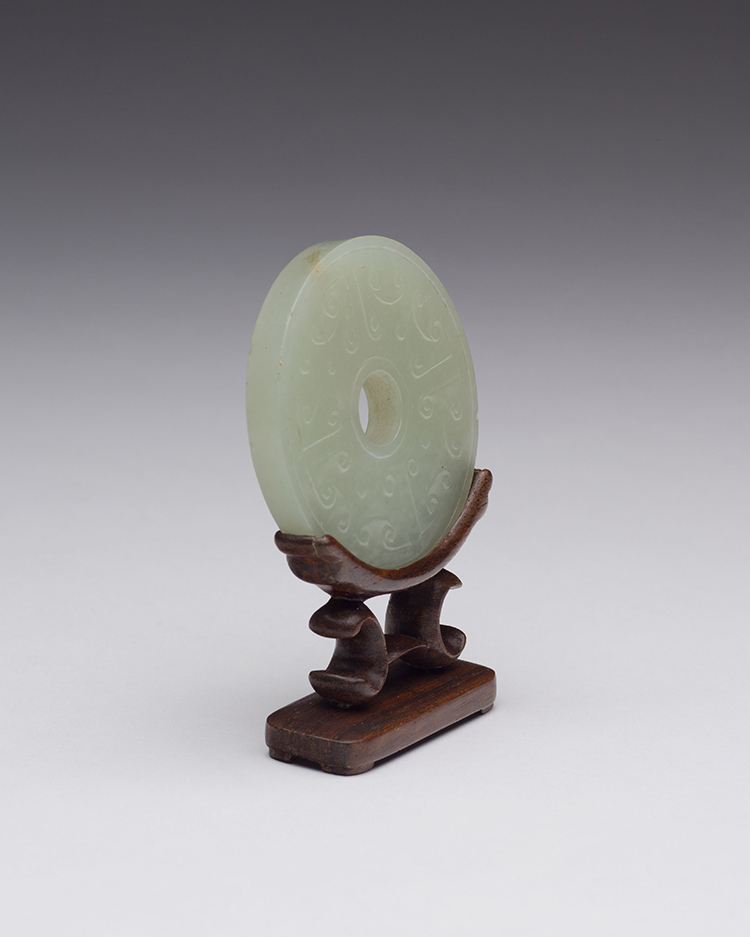 A Chinese Pale Celadon Carved Bi Disc, 19th Century par  Chinese Art