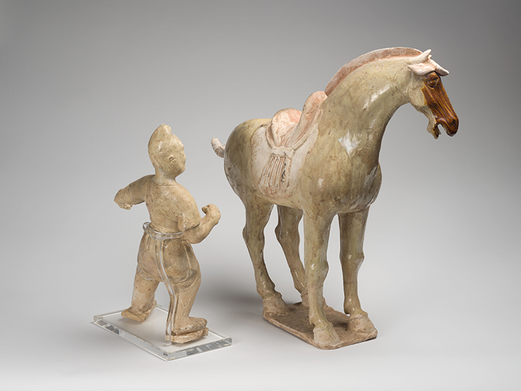 A Chinese Straw Glazed Earthenware Figure of a Groom and Horse, Tang Dynasty (618-907 CE) by  Chinese Art