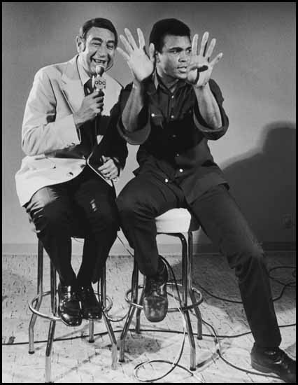 Ali with Howard Cosell, Prior to Joe Bugner Fight - Ali with Both Hands up Gesturing by Neil Leifer