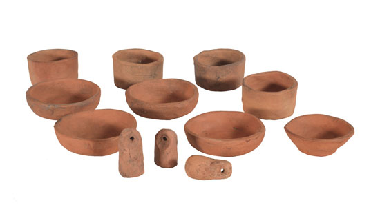 Klee Wyck ceramics: 5 dishes, 4 cups and 3 small weights with holes by Emily Carr